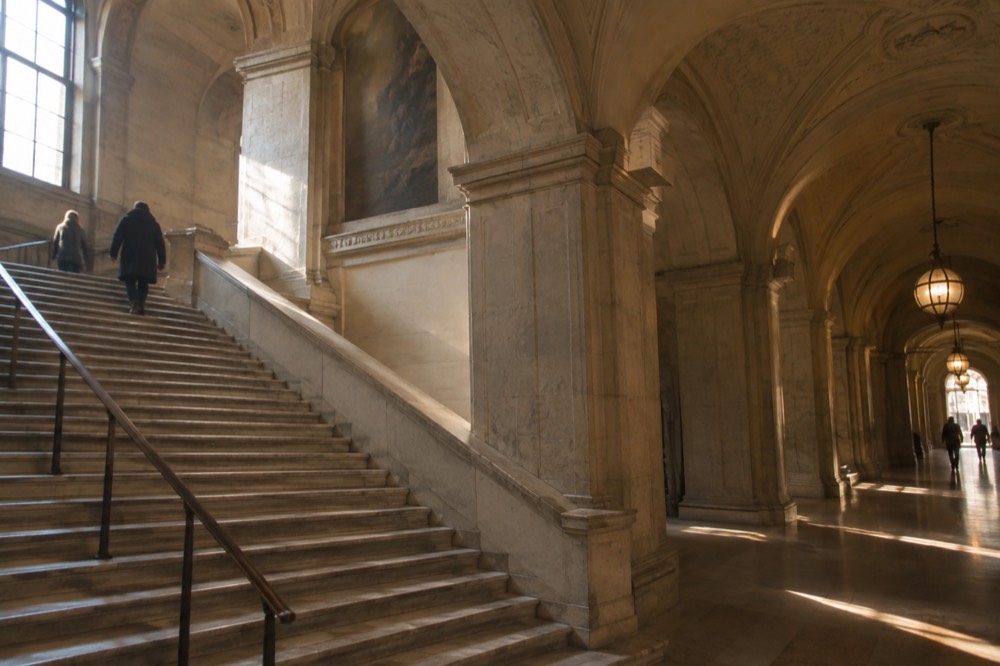 Grand staircase and arched hallway inside the Boston Public Library's McKim Building