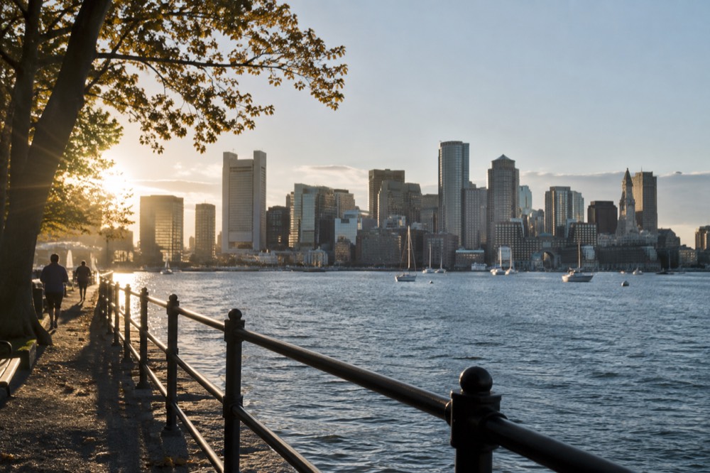 Boston's waterfront skyline seen from the harbor on a clear afternoon