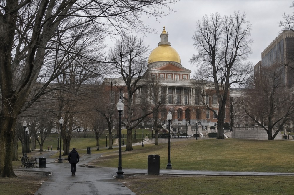 The gilded dome of the Massachusetts State House seen from Boston Common