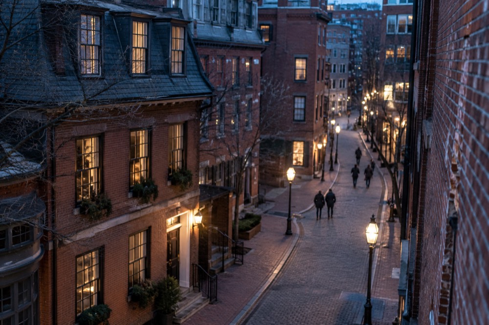 Red brick historic buildings along a walking route in downtown Boston on a clear day