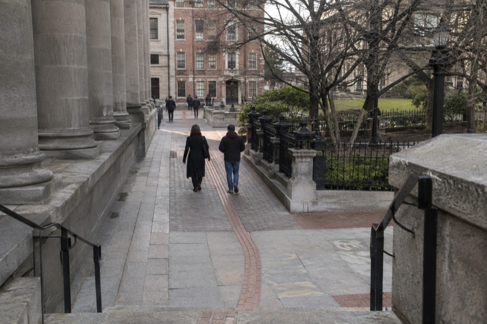 The red brick line of the Freedom Trail passing historic buildings in downtown Boston