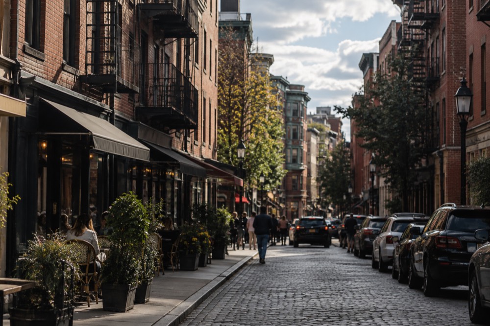 Hanover Street in the North End lined with brick buildings and Italian restaurants