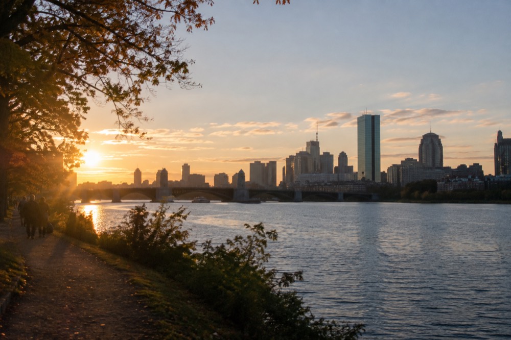 The Back Bay skyline and Longfellow Bridge seen across the Charles River at golden hour