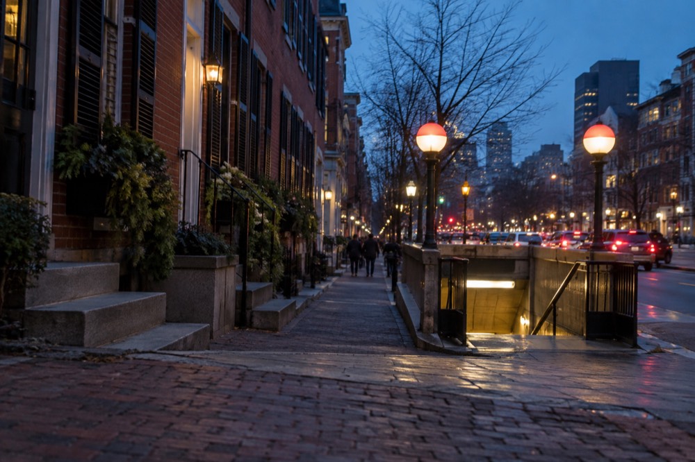 Red Line station entrance near the base of Beacon Hill beside a busy street