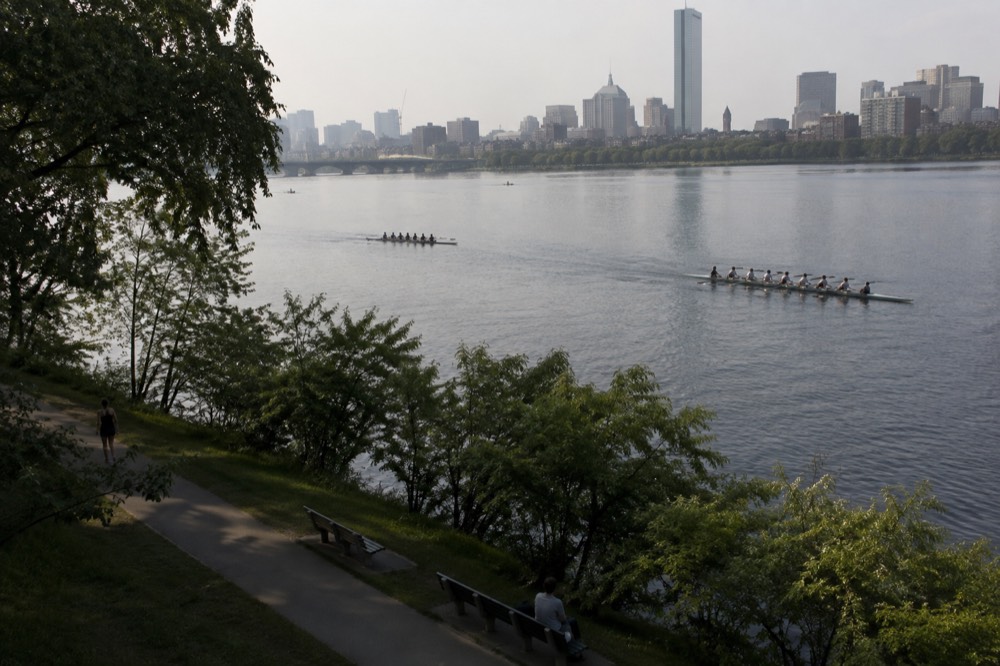 View of the Charles River and rowing shells from the Esplanade below Beacon Hill
