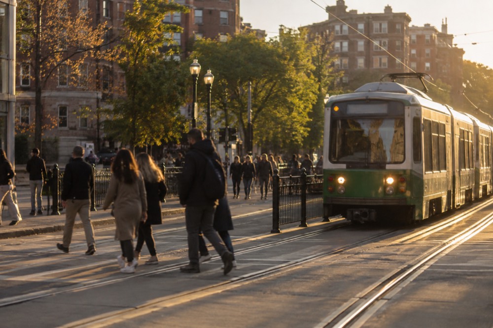The Green Line tracks running through Kenmore Square with pedestrians crossing