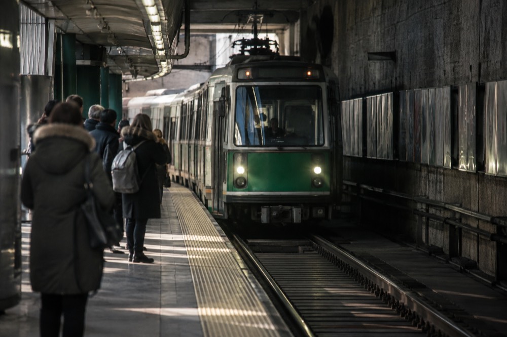 A Green Line trolley arriving at an underground Boston station platform