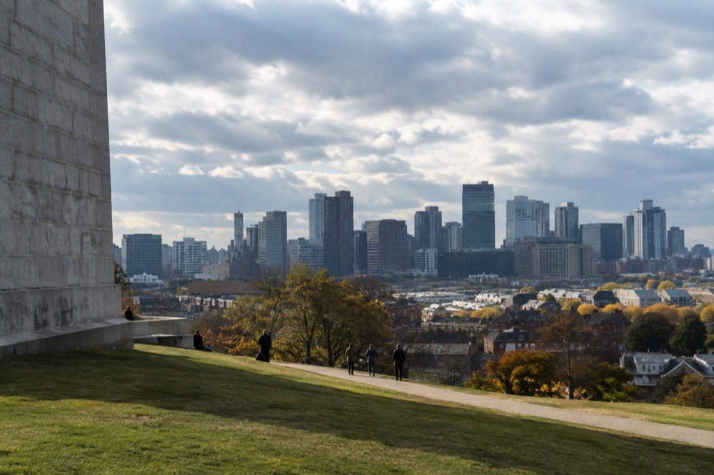 The Boston skyline seen across the water from a Charlestown hilltop