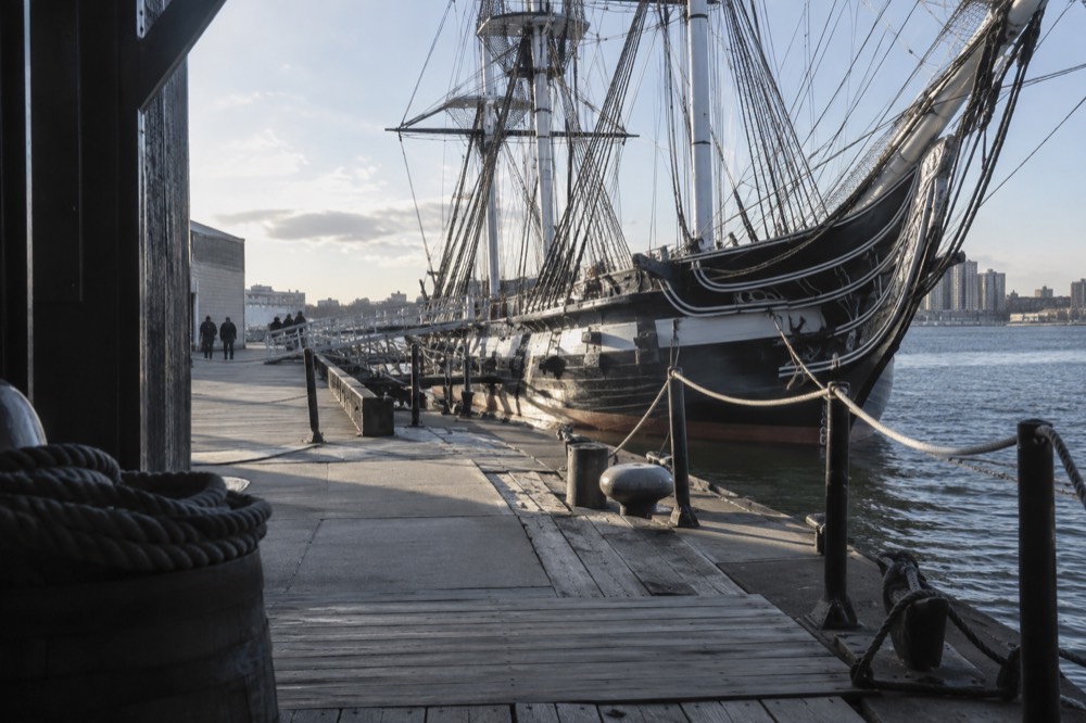 USS Constitution warship docked at the Charlestown Navy Yard pier