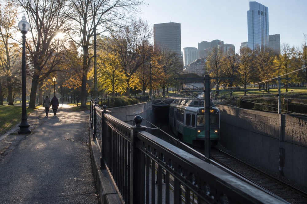 Green Line trolley arriving at an underground MBTA station near Boston Common