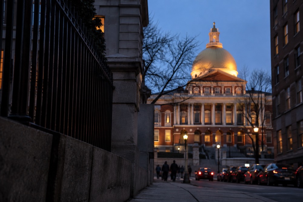 Sunlight on the gilded dome seen from a downtown Boston street