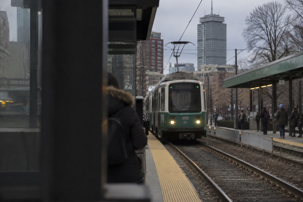 Green Line trolley arriving at a Back Bay subway station near the Prudential Center