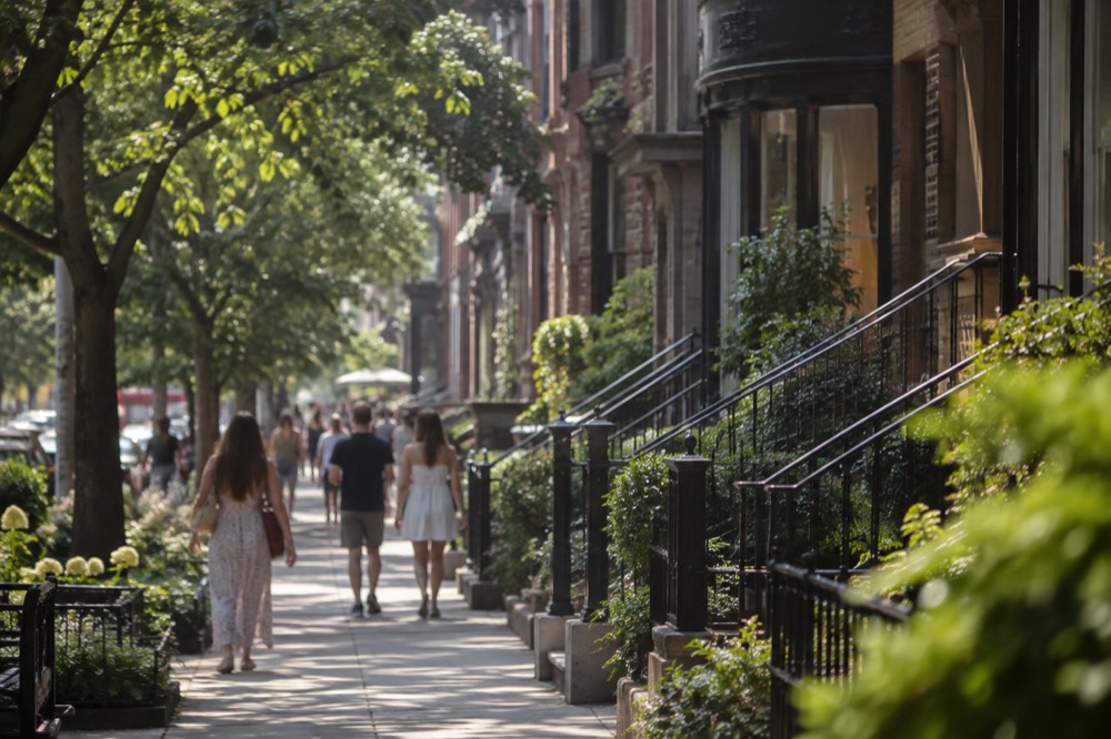 Newbury Street brownstones with shops at street level on a busy afternoon
