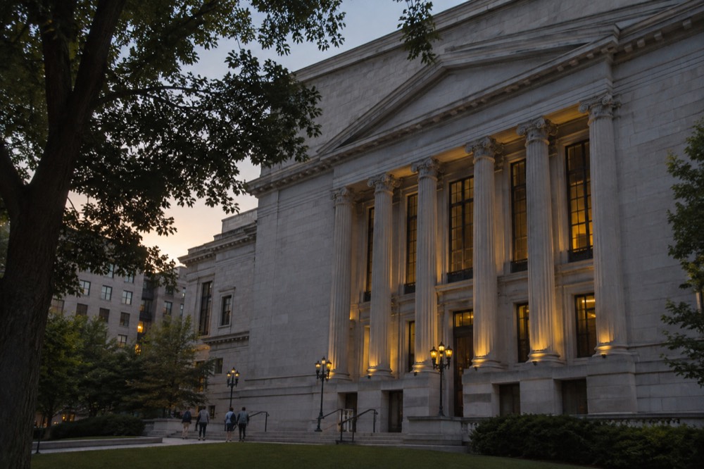 A grand art museum facade with tall columns at dusk