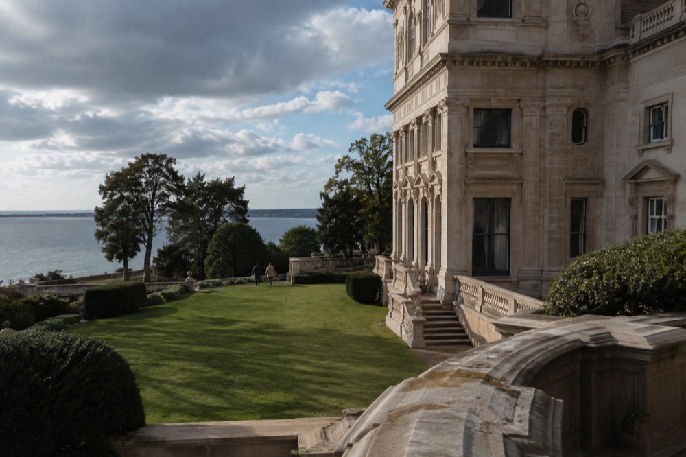 The stone facade and lawn of a Gilded Age mansion on Bellevue Avenue in Newport