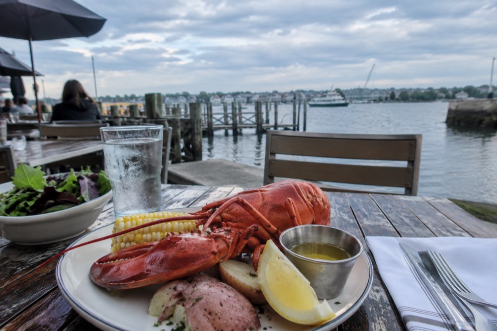 A plated seafood lunch on a wooden restaurant table