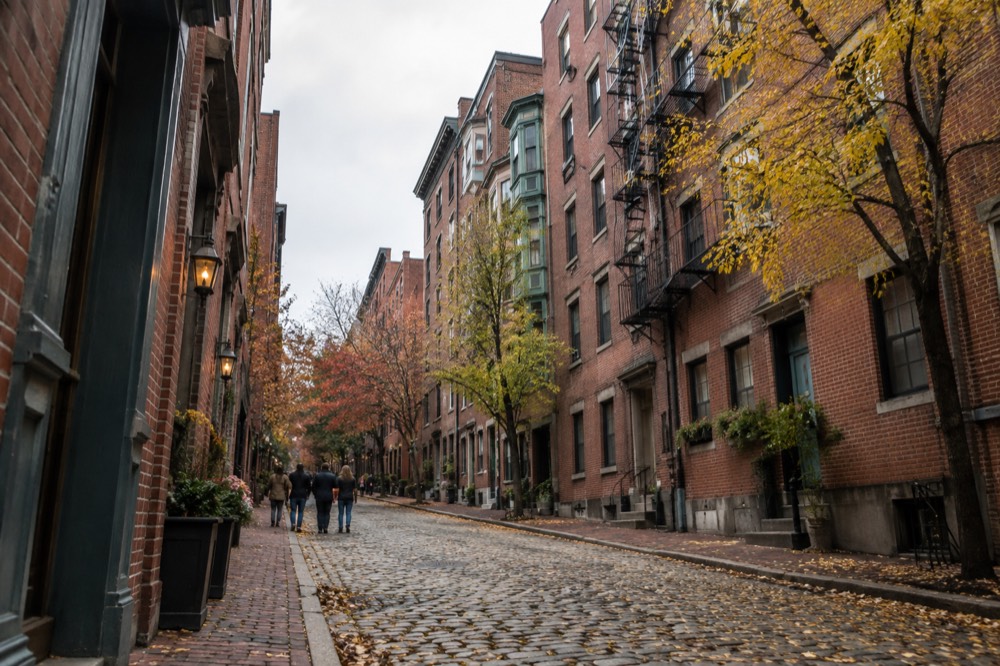 Historic Salem street with period architecture under an autumn sky