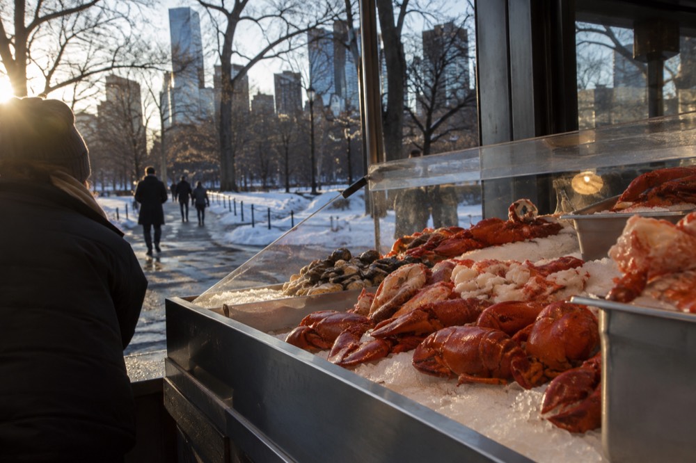 A seafood counter in Boston displaying fresh lobster meat on ice
