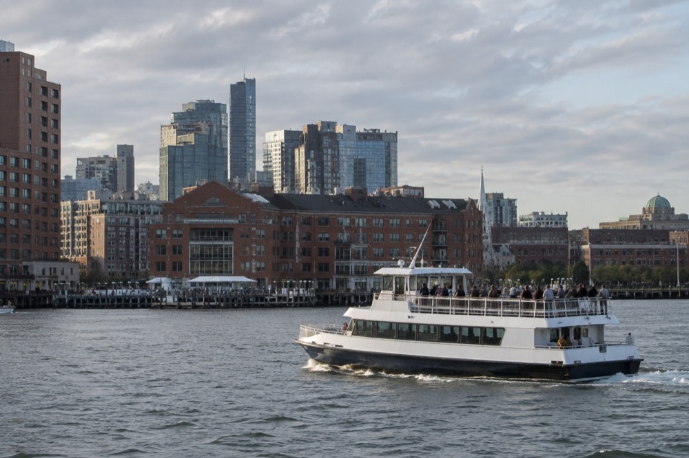 A sightseeing cruise boat passing the Boston waterfront