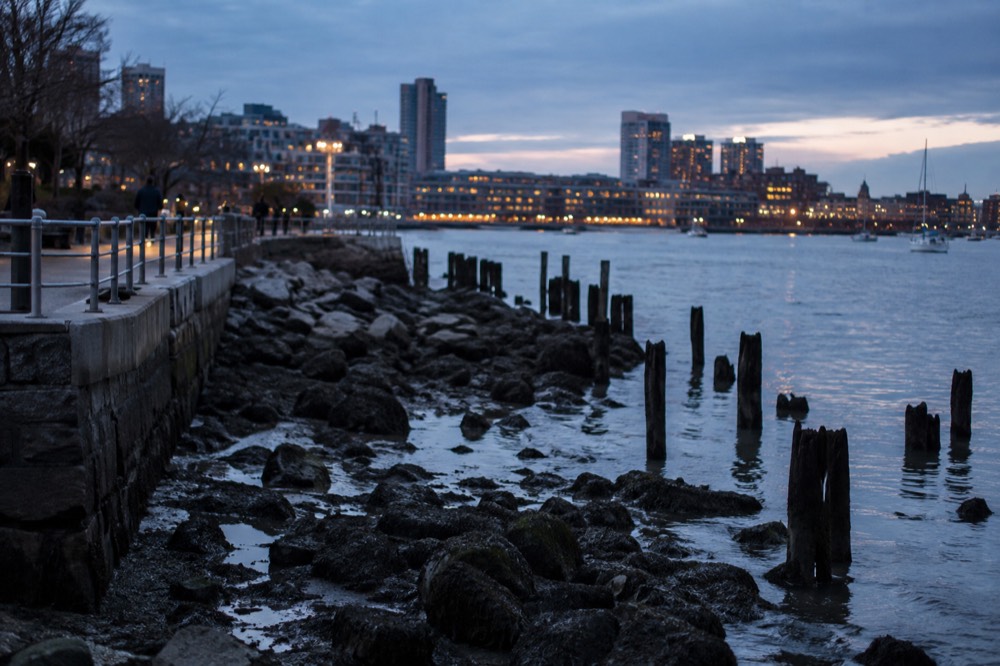 Exposed rocks and pilings along the Boston Harborwalk at low tide