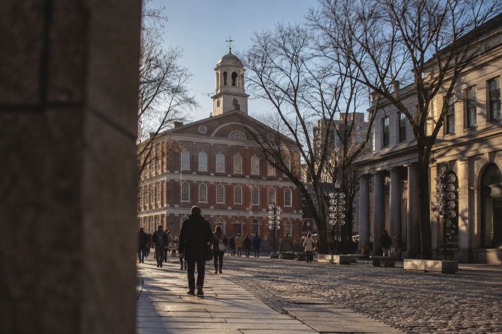 Faneuil Hall's brick facade and grasshopper weathervane in downtown Boston