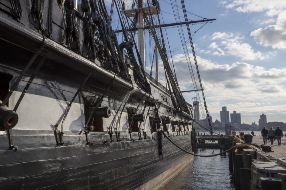 The wooden hull of the USS Constitution docked at the Charlestown Navy Yard