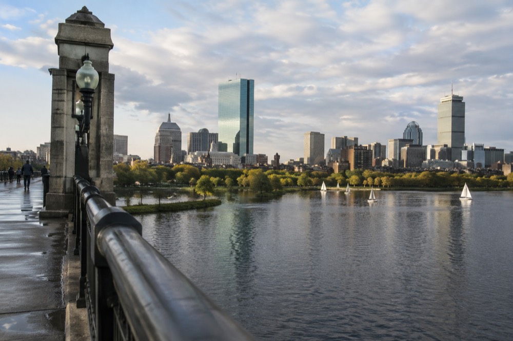 A view of the Boston skyline from a bridge with the Charles River below