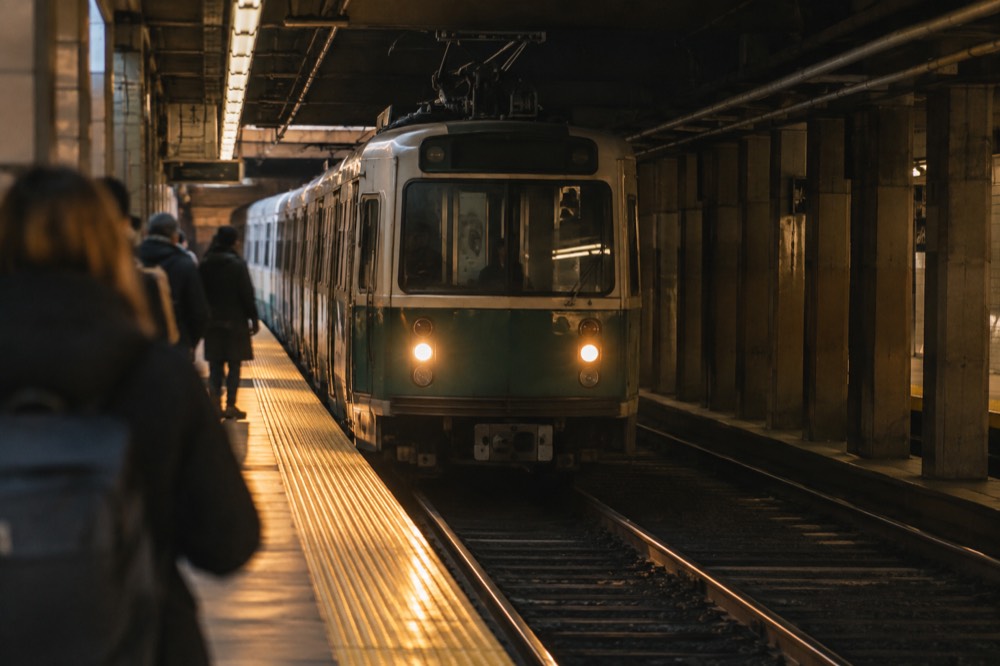 A Green Line trolley arriving at an underground MBTA platform