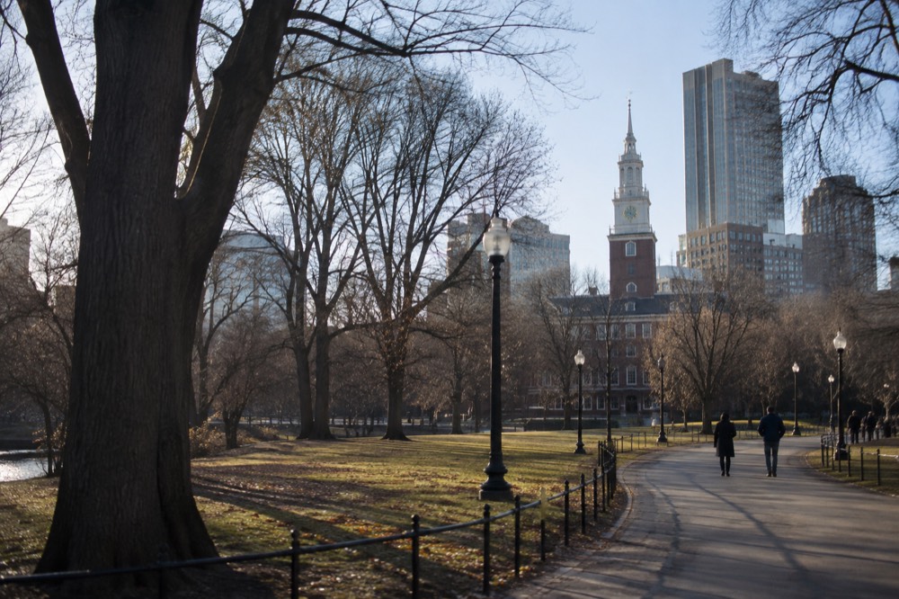 Independence Hall's brick tower and clock against a clear sky