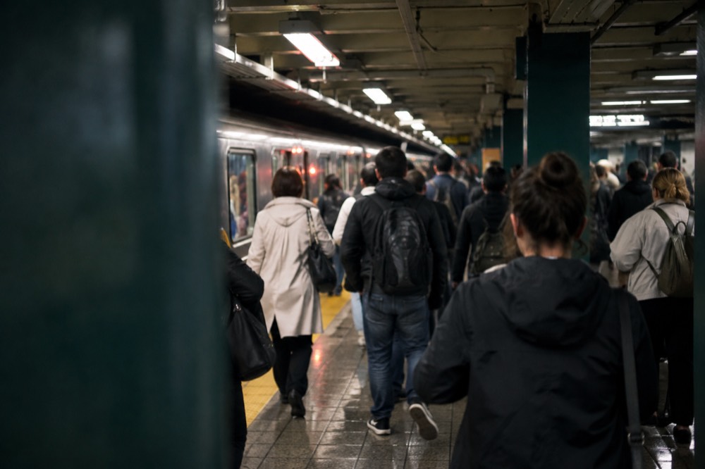 Subway platform crowded with fans after an evening event