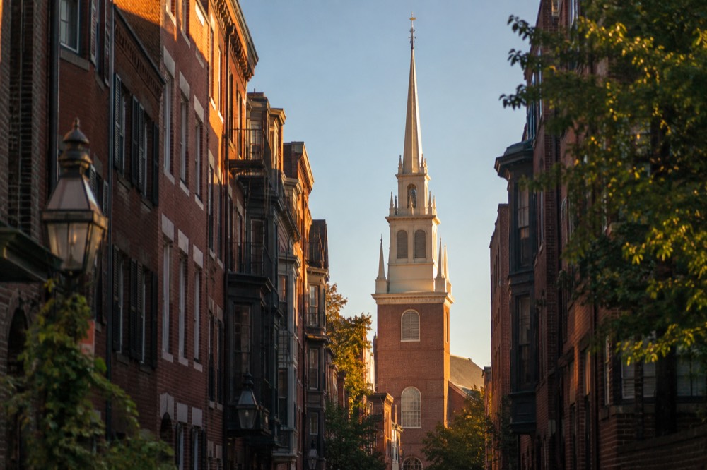 The red brick Old North Church standing against a clear sky in Boston's North End