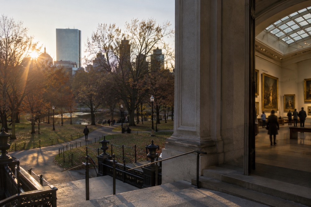 A grand museum gallery with paintings and skylight in Boston