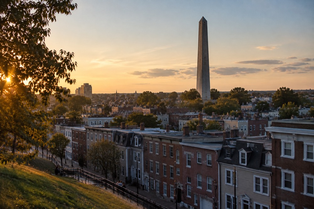 The granite obelisk of the Bunker Hill Monument rising above Charlestown rooftops