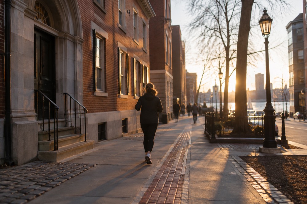 Red brick lane in Boston passing historic colonial buildings on the Freedom Trail