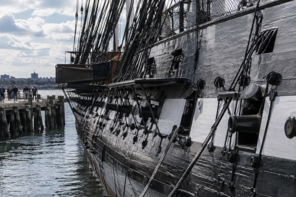 The wooden hull of USS Constitution at its berth in the Charlestown Navy Yard