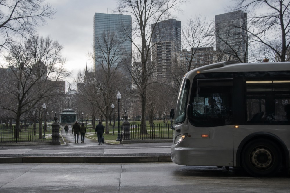 A Silver Line bus at an airport terminal curb in Boston