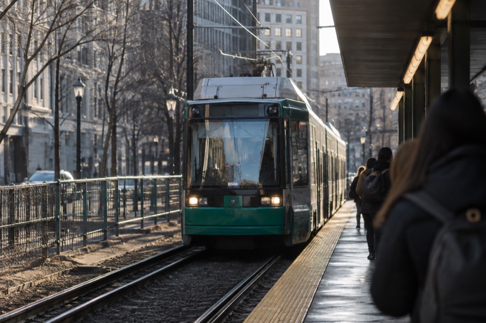 A Green Line trolley arriving at a downtown Boston subway platform