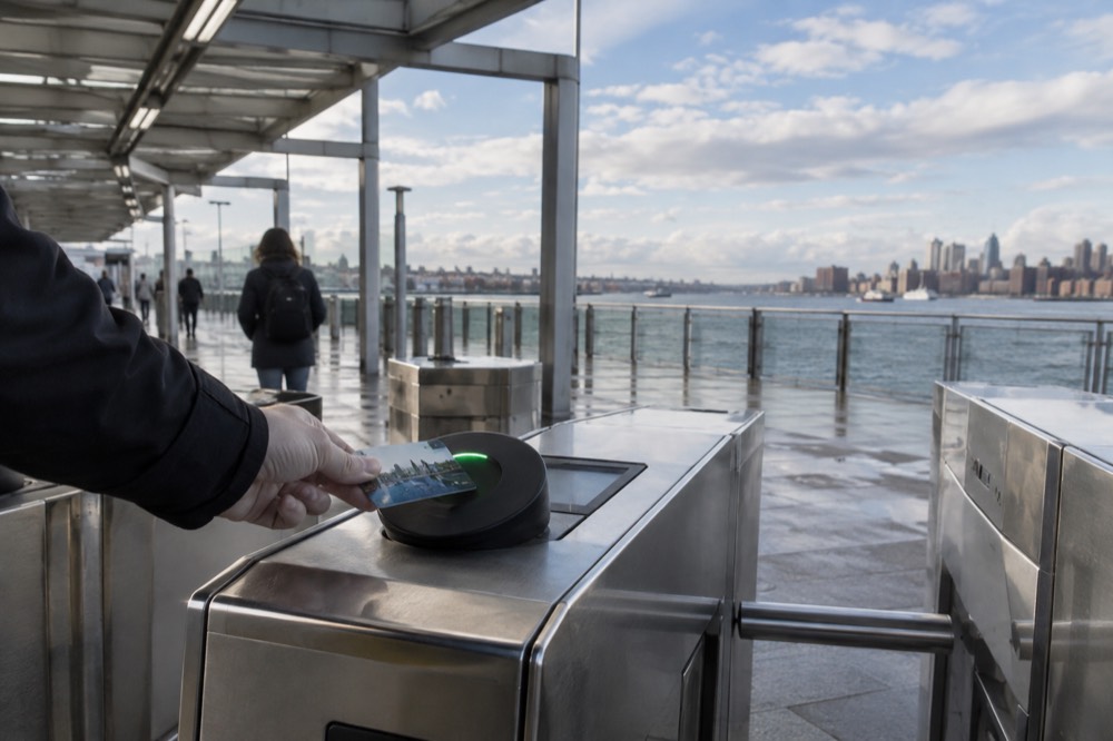 A CharlieCard being tapped at an MBTA station fare gate