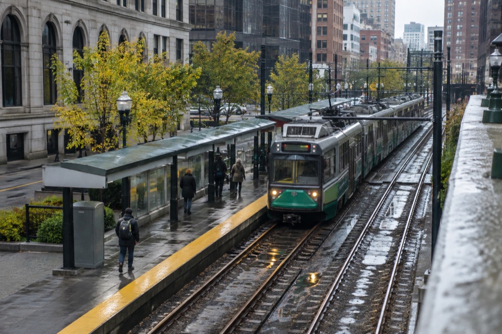 A Green Line trolley arriving at a downtown Boston MBTA station platform