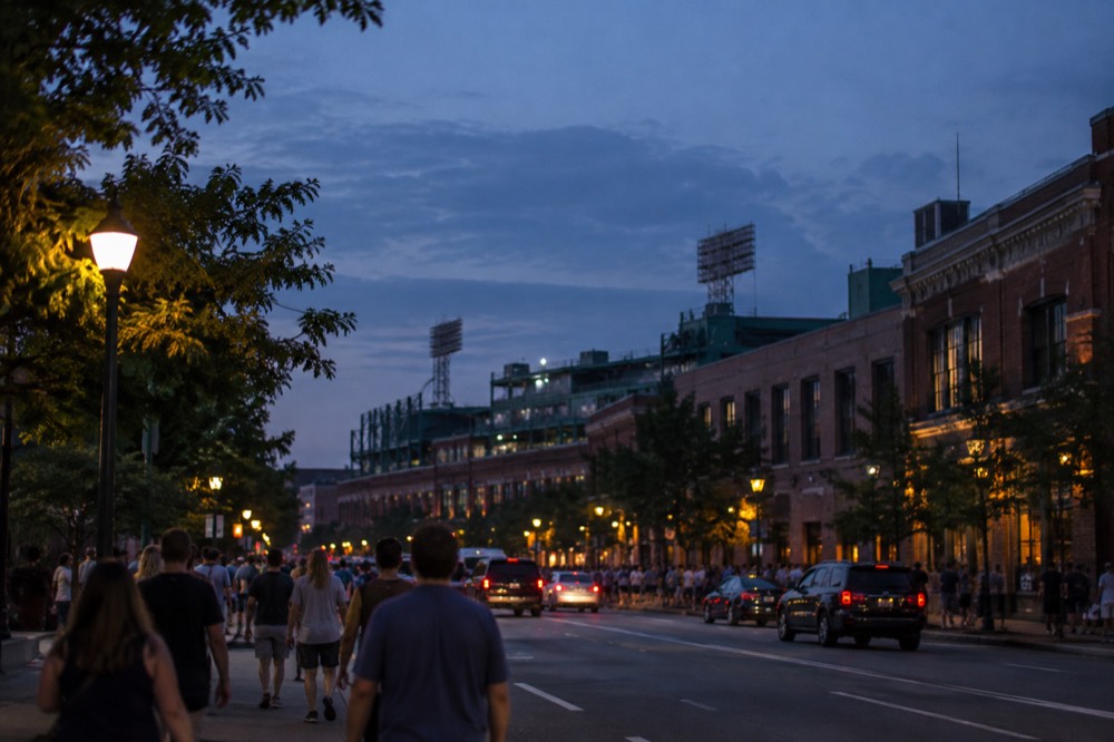 Fenway Park's green wall and ballpark seats under a summer sky