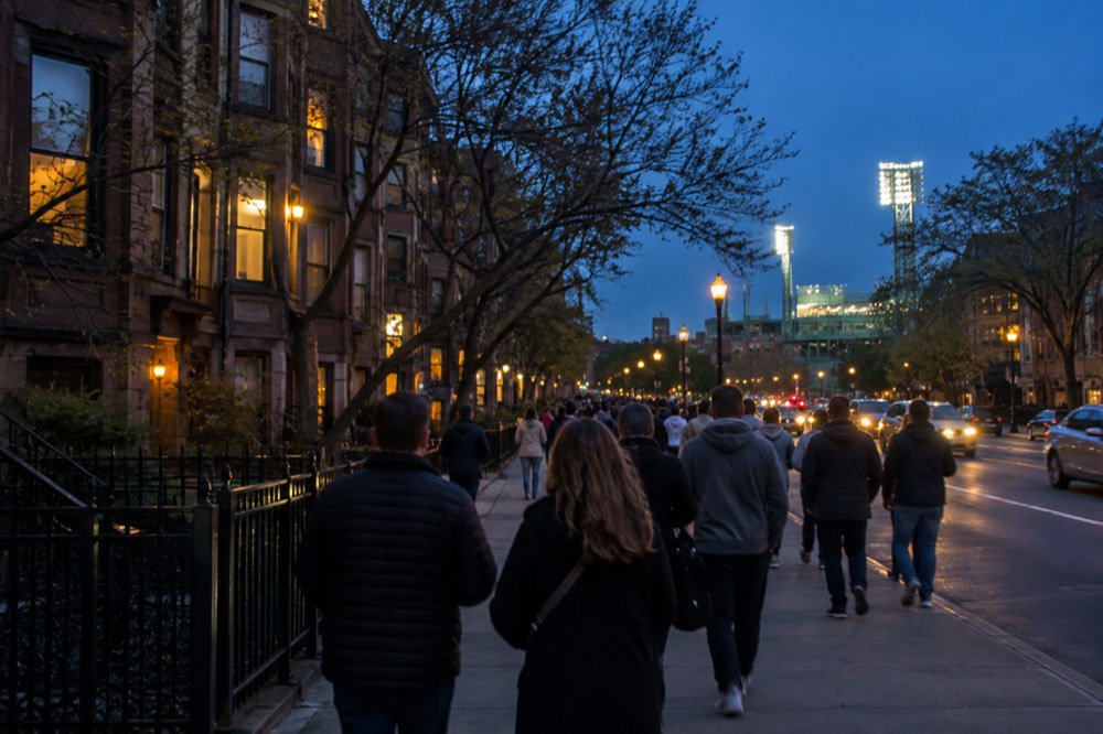 Crowds walking down Brookline Avenue toward Fenway Park before a game