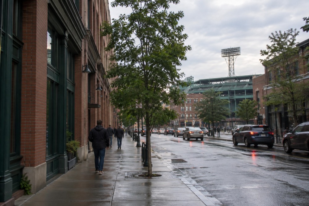 The green Fenway Park field and grandstand seen from the stands on a tour