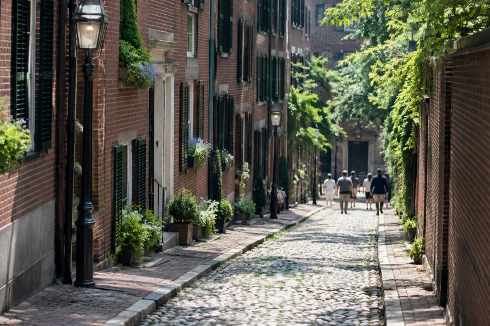 Acorn Street in Beacon Hill, a narrow cobblestone lane with brick row houses