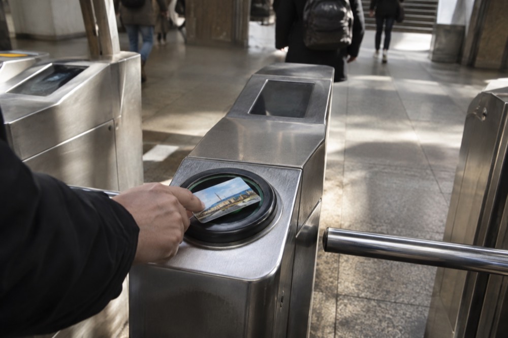 A CharlieCard being tapped at an MBTA subway station fare gate