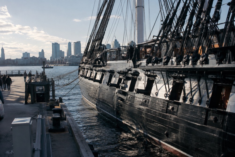 The wooden hull of the USS Constitution moored at the Charlestown Navy Yard