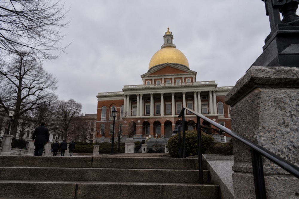 The gilded dome of the Massachusetts State House above Beacon Street