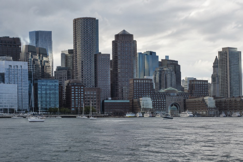 Downtown Boston skyline seen across the harbor from the water