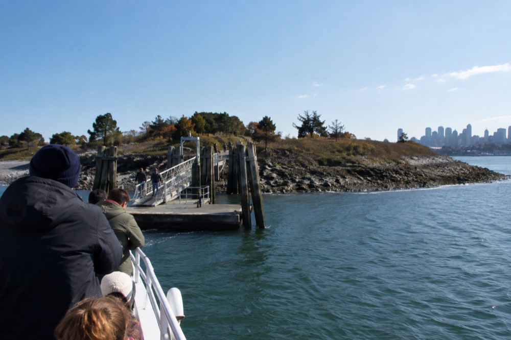 A ferry approaching a Boston Harbor island dock
