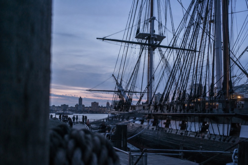 USS Constitution moored at the Charlestown Navy Yard with its wooden hull and rigging